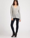 A featherweight pullover tailored with a modern dropped shoulder and asymmetrical hemline.V necklineDropped shouldersLong sleeves50% alpaca/50% merino woolDry cleanImported