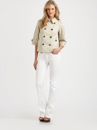 A cropped design with classic double-breasted trench details, including button tabs on three-quarter sleeves.Collar neckButton-tab detail on three-quarter sleevesButton frontSlash pocketsBack ventAbout 32 from shoulder to hemCottonDry cleanImported Model shown is 5'10½ (179cm) wearing US size 4. OUR FIT MODEL RECOMMENDS ordering true size. 