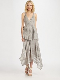 Tonal striped highlight this airy jersey knit crafted with a tiered handkerchief hem.V necklineSleevelessWrap-around beltTiered hemRacerbackAbout 43 from natural waist55% rayon/45% spandexDry cleanMade in USAOUR FIT MODEL RECOMMENDS ordering true size. 