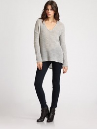 A featherweight pullover tailored with a modern dropped shoulder and asymmetrical hemline.V necklineDropped shouldersLong sleeves50% alpaca/50% merino woolDry cleanImported