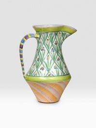 A verdant garden patio piece is handcrafted and individually painted with tall flowers and sherbet-hued stripes by master ceramics artisans. For an especially one-of-a kind touch, each piece bears the hand-placed stamps of the artisans who created it. Dishwasher- and microwave-safe 12-ounce capacity 12H X 7½ diam. Made in USA