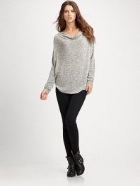 Slouchy, textured-knit cowlneck with long dolman sleeves and a curved hi-low hem. CowlneckDropped shouldersLong dolman sleevesCurved hi-low hemLonger length hits below the hips71% viscose/24% polyester/5% spandexDry cleanMade in USAModel shown is 5'11 (180cm) wearing US size 4.