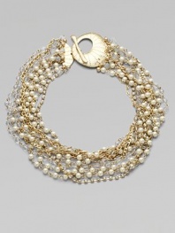 A dramatic statement, combining twisted strands of sparkling rhinestones, creamy glass pearls, faceted clear beads and golden chains into a striking piece.GlassGoldtoneLength, about 17Toggle closureImported