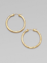 From the Martellato Collection. Graceful hoops with a rich hammered texture in gleaming 18k gold.18k yellow goldDiameter, about 1¾PiercedMade in Italy