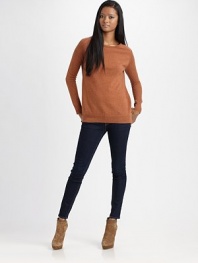 Sassy wool crewneck with semi-sheer, open-stitch sleeves and a split hem. Ribbed crewneckLong open-knit sleevesRibbed cuffsRibbed split hemWoolDry cleanImported