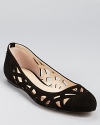 Geometric cut-outs add artful flair to Calvin Klein's Emilia flats, constructed in soft black suede for a classic look.