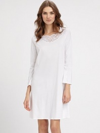Fresh and utterly feminine, a classic silhouette of super-soft cotton with pretty embroidered lace and long cozy sleeves. Boatneck with floral semi-sheer embroidered laceLong sleevesA-lineAbout 39½ from shoulder to hemMercerized cottonMachine washImported 