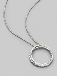 From the Silver Ice Crossover Collection. Two intertwining rings, one of sterling silver cable, the other of white gold set with pavé diamonds, hanging elegantly from a sterling silver box chain. Diamonds, 0.39 tcw Chain length, about 16 Pendant diameter, about 1 Lobster clasp Made in USA