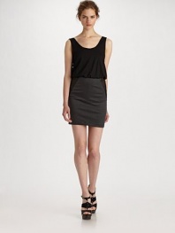 A striking one-piece number with a layered cowlneck bodice and contrast leather insert skirt.Cowl neckline Sleeveless Fitted skirt with contrast leather inserts About 36 from shoulder to hem 75% viscose/10% leather/7% polyester/5% spandex/3% rayon Dry clean by a leather specialist Imported