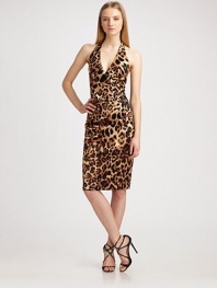 Demure, stretch-satin halter emboldened by a primal leopard print. Halter neckline Invisible back zipper Fully lined About 24 from shoulder to hem 57% viscose/40% cotton/3% Lycra Dry clean Made in USA of Italian fabric