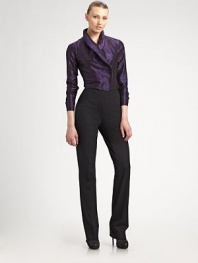 An elegant design, with a concealed button-down front and a unique overlapping wing collar.Wing collar Button-down front and button cuffs Silk Dry clean Imported of Italian fabric