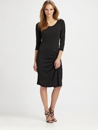 A refreshing take on the LBD, this elegant design features sporty raglan sleeves, an asymmetrical waistline and flattering side ruching.Round necklineRaglan sleevesRuched side detailAbout 37 from shoulder to hem70% rayon/24% polyester/6% spandexDry cleanImported Model shown is 5'10½ (179cm) wearing US size 4. 