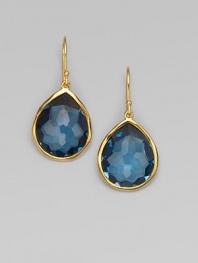 A deeply hued, richly faceted teardrop of London blue topaz shimmers within a delicate setting of 18k gold. London blue topaz 18k yellow gold Drop, about 1¼ Ear wire Imported
