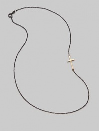 A gleaming 14K gold cross on an oxidized silver chain.14K gold Oxidized sterling silver Length, about 16 Pendant length, about ¾ Lobster clasp closure Made in USA 