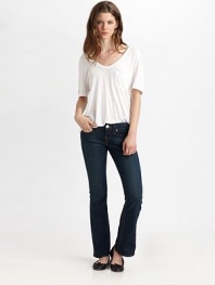 Five-pocket petite bootcut silhouette in clean, crisp denim enhanced with button-flap back pockets with signature stitching.THE FITFitted through hips and thighs Medium rise, about 8 Inseam, about 30THE DETAILSZip fly Five-pocket style Button-flap coin pocket 94% cotton/5% polyester/1% spandex Machine wash Made in USA
