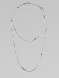 A long-enough-to-double sterling silver chain, delicately spaced with clusters of tiny, faceted 14k gold beads.14k yellow gold and sterling silverLength, about 40Spring ring claspMade in USA