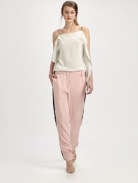 Tailored silk trousers have zippers at each side that adjust to reveal contrast inset panels.Bandless waistBelt loopsZip flySmooth frontWorking zippers at each side seam, from above the knee to the ankleBack besom pocketsRise, about 11Inseam, about 30½SilkDry cleanImported