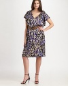 A head-turning animal print, flattering neckline and waist-cinching belt make this one of the most amazing, curve-flattering designs around.V-neckFlutter sleevesRemovable beltSide zipperFully linedAbout 42 from shoulder to hem80% rayon/20% silkDry cleanImported