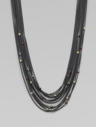 From the Blackened Chain Collection. This beautiful, multi-row design is embellished with faceted garnet, hematite and 18k gold station beads. Garnet, hematite and 18k gold beadsBlacked sterling silverLength, about 16½ to 18½ adjustableToggle closureImported 