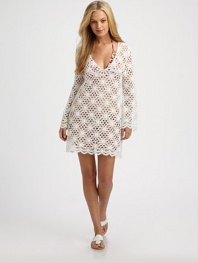 A crochet coverup that is beyond gorgeous.V-neckLong sleevesPull-on stylePolyesterDry cleanMade in USA of imported fabric