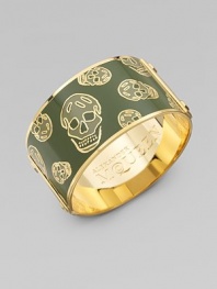 This feminine take on punk rock features creepy-cool skulls, stud details, and Alexander McQueen engraved logo on the interior and exterior.Enamel Brass Diameter, about 2½ Width, about 1¼ Made in Italy