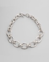 Chunky graduated links of hammered sterling silver make a bold and beautiful statement. Sterling silver Length, about 20 Toggle closure Imported