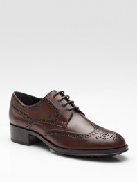 Oxford-inspired, leather style has a lace-up front and intricate cut-out details. Leather upper Leather lining Rubber sole Padded insole Made in Italy