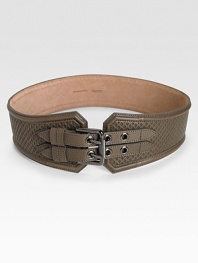 This supple, leather style features a double prong, logo engraved, gunmetal-finished metal buckle. Width, about 2½Made in Italy