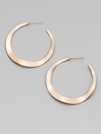 Simple, subtle wavy hoops, in sterling silver and 18k gold, glow with the warm finish of 18k rose goldplating.18k gold and sterling silver with 18k rose goldplatingDrop, about 1½PiercedImported