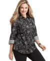 A floral print lends a feminine finish to Karen Scott's three-quarter sleeve plus size shirt, accented by striped cuffs.