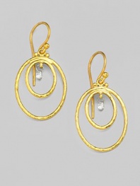 From the Geo Collection. Charming, white diamond briolettes dangle within two oval rings of hand-hammered, 24k yellow gold. Diamonds, 0.23 tcw 24k yellow gold Drop, about 1¼ Width, about ¾ Ear wire Imported 