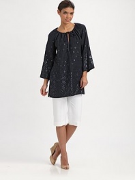 An enticing tunic with spectacular beading, a flattering fit and convenient slash pockets. Round neckSelf-tieThree-quarter sleevesSlash pocketsPull-on styleAbout 32 from shoulder to hemLinenDry cleanImported