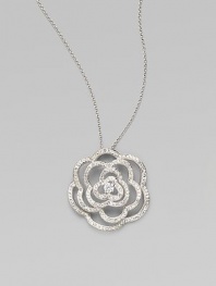 EXCLUSIVELY AT SAKS. The petals of our open flower pendant are paved with dazzling crystals and accented with a center stone of cubic zirconia. Cubic zirconia and crystal Rhodium plated Chain length, about 16 with 2 extender Pendant diameter, about 1½ Lobster clasp Imported
