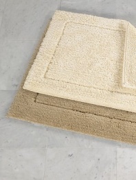 Crafted in a century-old mill in Portugal, this reversible rug offers plush tufting on one side, thick loops on the other, both luxurious underfoot.Reversible Small: 20 X 31 Large: 23 X 39 Cotton Machine wash Imported