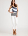 Sporty cotton scoopneck in allover bold stripes has an on-trend racerback and hits below the hips. ScoopneckSleevelessRacerbackLonger length hits below the hipsCottonHand washImported
