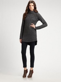 This chunky knit of wool and alpaca skims the body in an elongated silhouette.Turtleneck Raglan sleeves Shirttail hem Ribbed trim Pullover style 45% wool/25% alpaca/30% polyamide Dry clean Imported