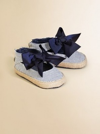 A great big striped bow with touches of sparkle adorns the front of a sweet denim sneaker with jute trim.Cotton denim upperJute edgingBack ankle zipper for easy on and offStriped fabric liningPadded insoleDenim soleImported