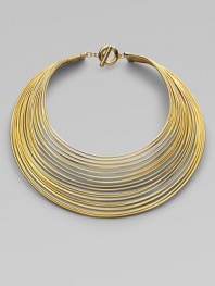 Totally simple and totally fabulous, this striking collar is gracefully formed of delicate brass wires with a polished finish.BrassLength, about 16Drop, about 8Toggle closeImported