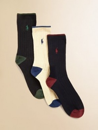 Three-pack of ribbed dress socks with contrast color tipping at cuff, pony, heel and toe. Each 3-pack includes black with green, white with blue, navy with red.Dress-style to wear with slacks85% cotton,14% polyester/1% spandexMachine washImported