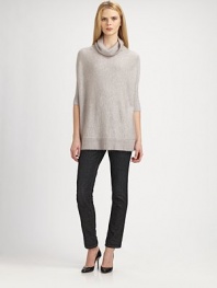A cozy-chic, poncho-inspired sweater with ribbed details.TurtleneckElbow-length dolman sleevesRibbed hemPull-on styleAbout 25 from shoulder to hem67% viscose/20% mohair/13% nylonHand washImported of Italian fabric Model shown is 5'11 (180cm) wearing US size Small. 