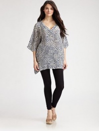 A classically chic top with an abstract print and fluttery, dolman sleeves.Solid trim along v-necklineDolman sleevesAllover printGathered back detail for a more flattering fitAbout 32 from shoulder to hemSilkDry cleanImported