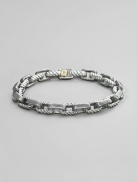 Textured empire link rendered in silver and 18k gold. Box clasp 8½ long Imported
