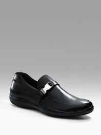 Soft calfskin with strap and logo buckle detail. Leather lining Padded insole Leather sole Made in Italy 