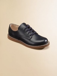 Eye-catching and iridescent, this lustrous leather design has contrast stitching with excellent support and comfort. Lace-up closure Rubber traction sole Padded insole ImportedPlease note: It is recommended that you order ½ size smaller than measured. If your child measures a size 7.0, you may want to order a 6½. 
