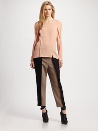 Tonal binding lends a contemporary edge to this breezy silk topper.Jewel neckline Long sleeves Vented hem Pullover style About 28 from shoulder to hem Silk; dry clean Imported