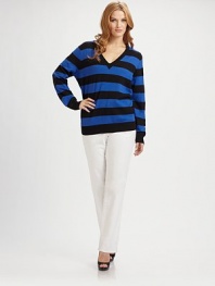 A classic silhouette with a bold striped pattern and sequin-adorned elbow patches for a uniquely charming look.V-neckLong sleevesRib-knit trimPull-on style52% cotton/45% polyester/3% angoraHand washImported