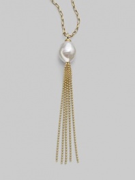 A striking white baroque pearl is the centerpiece of this delightful design, accented with a tassel of delicate gold chains. 16mm baroque, organic, man-made white pearl 18k gold vermeil Length, about 36 Made in Spain