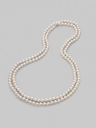 A strand of lustrous white organic pearls goes on and on, down past your waist, to wear long, wrapped or knotted. 8mm white round man-made pearls Length, about 60 Made in Spain