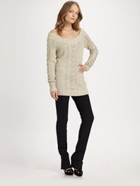 Glimmering metallic threads and a boatneck lend a touch of glam to this relaxed, cable-knit design. Ribbed boatneckLong sleevesRibbed cuffs and hem59% cotton/36% acetate/5% metallicDry cleanImported