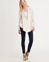 A lightweight blazer with an asymmetrical hem is a must-have casual cool spring look. Notched collarDropped shouldersLong sleeves with button cuffsSingle button front closureDual patch pocketsAsymmetrical hemAbout 20¾ from shoulder to hem90% rayon/10% nylonDry cleanImportedModel shown is 5'10 (177cm) wearing US size 4.